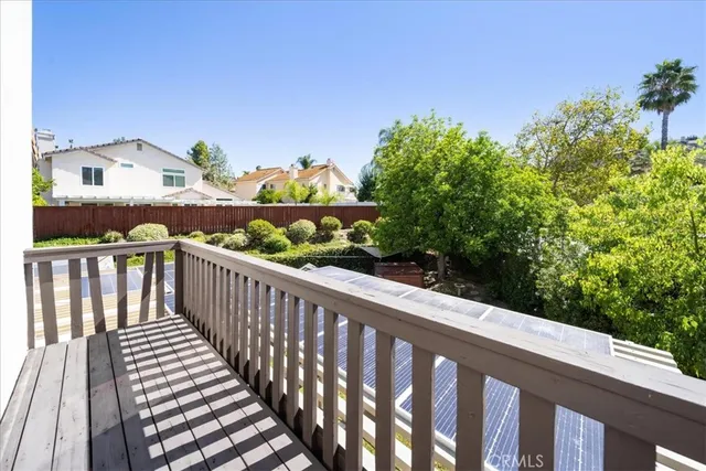 a front view of a house with swimming pool having outdoor seating