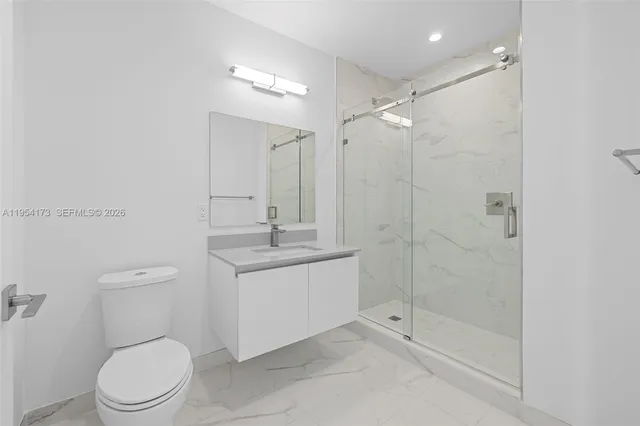 a kitchen with a table and chairs in it