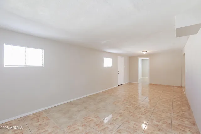 an empty room with windows