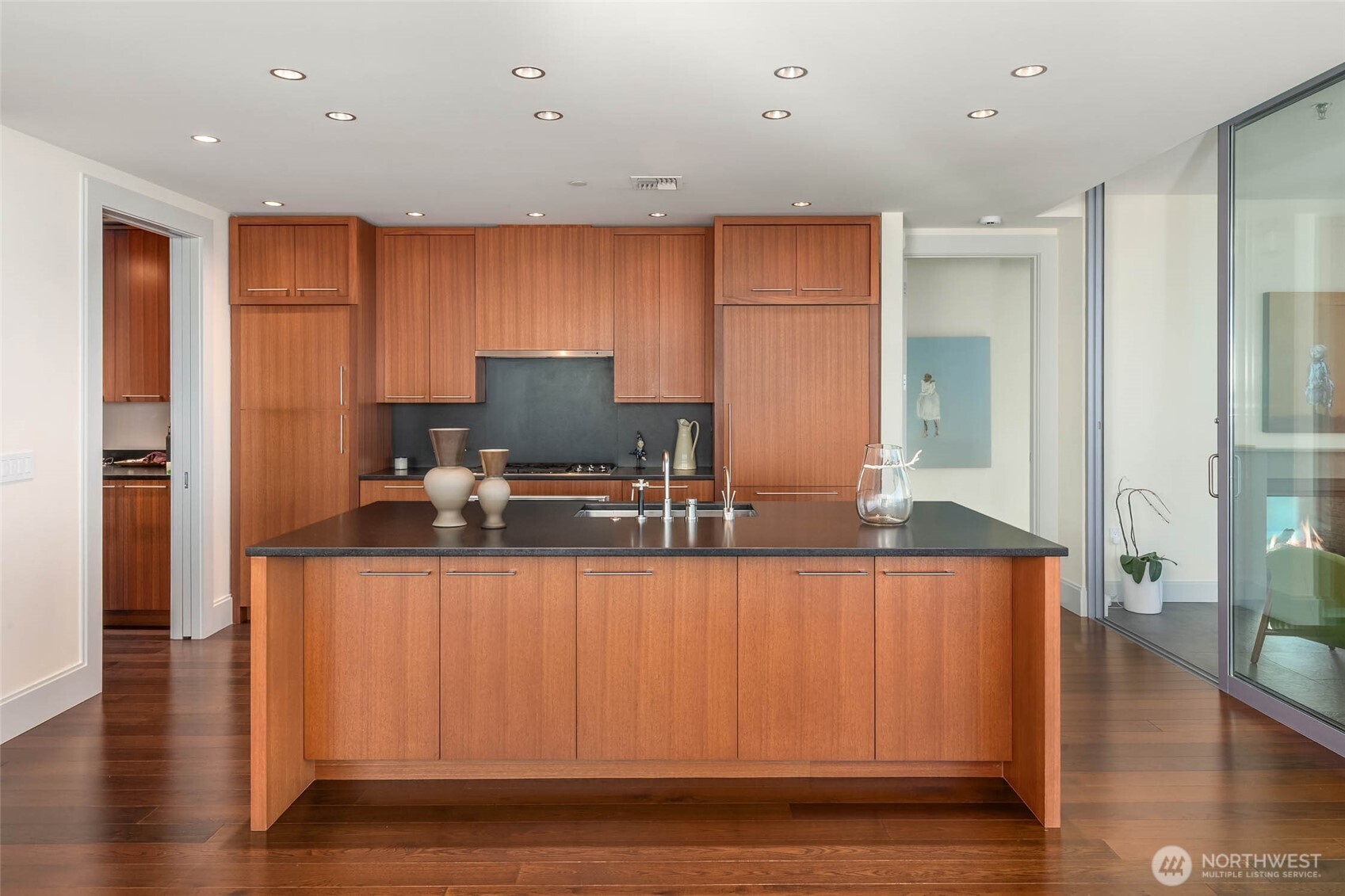 1521 2nd Avenue, Unit 3100 Seattle, WA 98101 - Photo 11 of 40 a kitchen with stainless steel appliances granite countertop a sink and a refrigerator