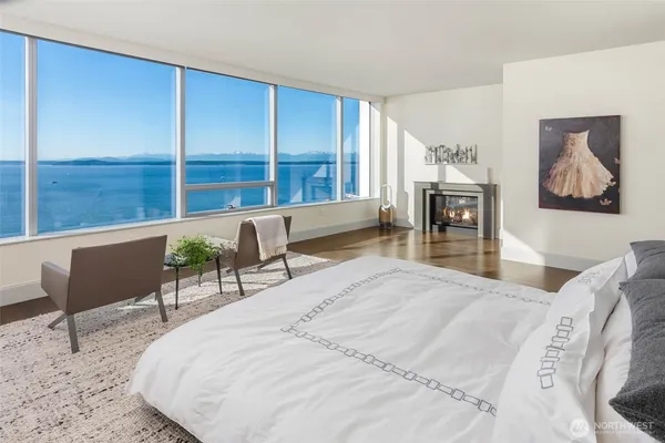 a bed room with a bed and a chair