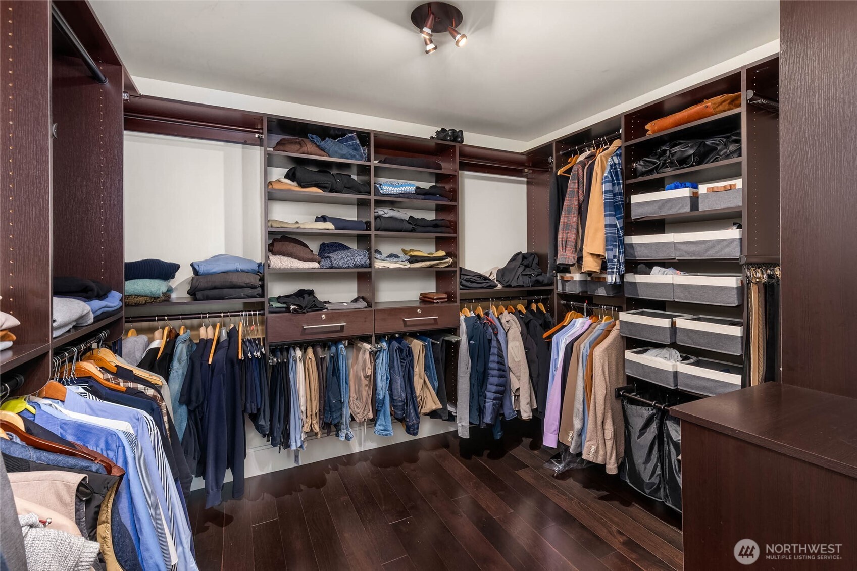1521 2nd Avenue, Unit 3100 Seattle, WA 98101 - Photo 23 of 40 a view of walk in closet with clothes and shoes