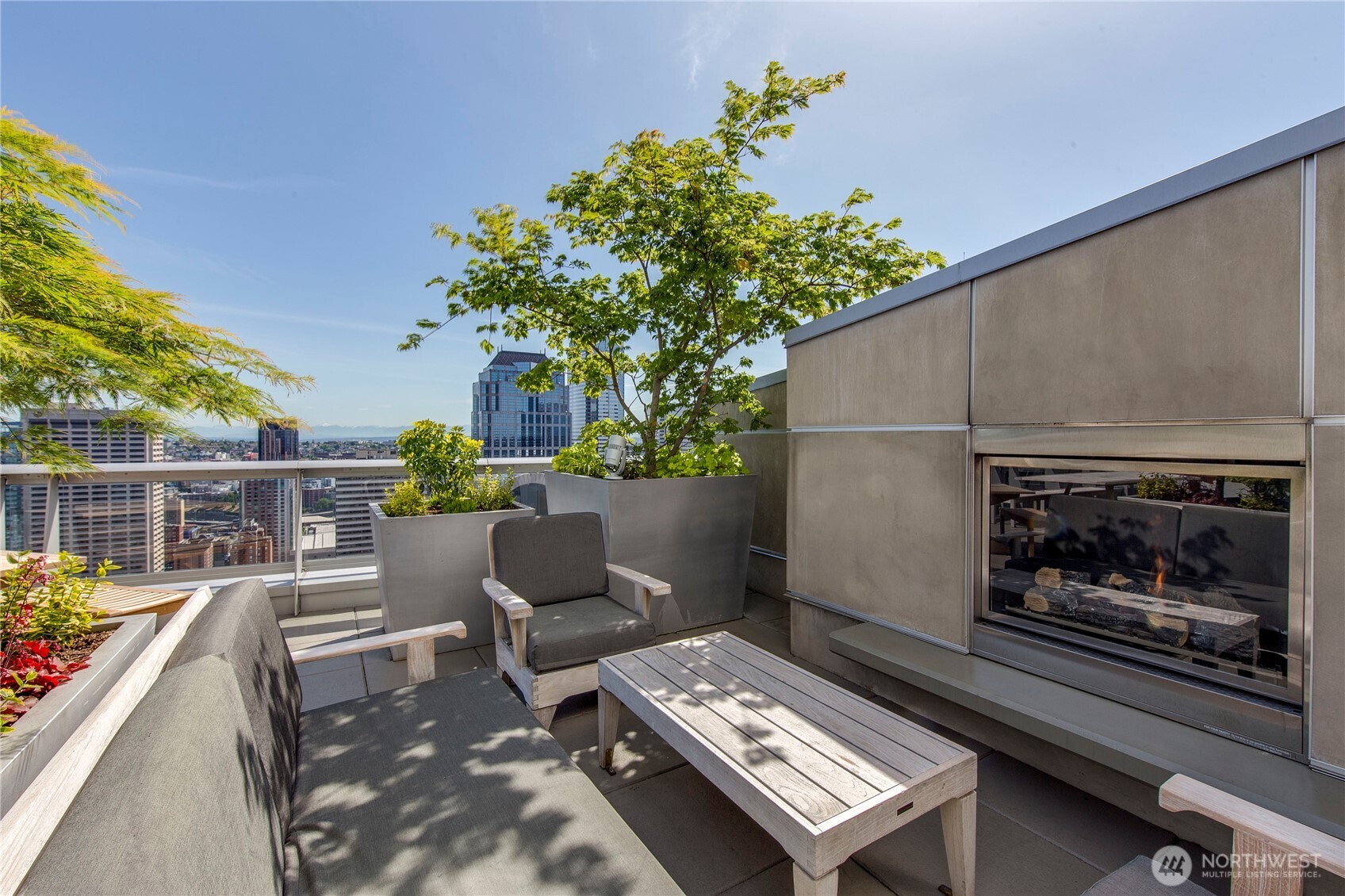 1521 2nd Avenue, Unit 3100 Seattle, WA 98101 - Photo 32 of 40 a outdoor living space with furniture and a fireplace