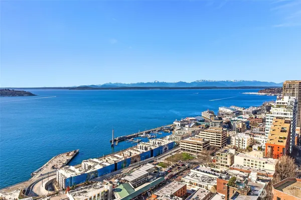 a view of ocean with a city skyline