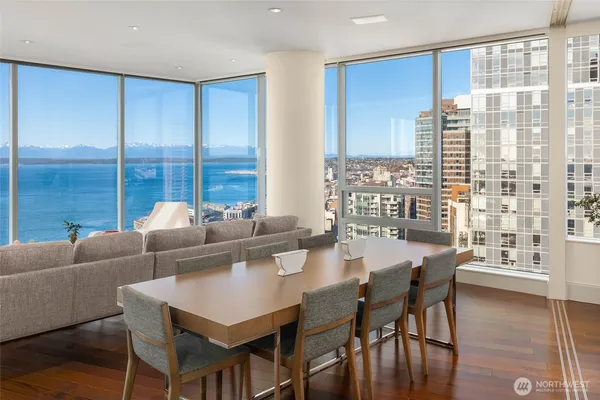 a view of a dining room with furniture and window