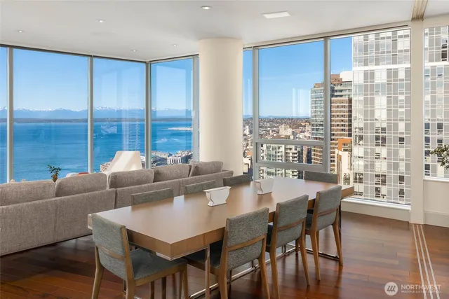 a view of a dining room with furniture and window