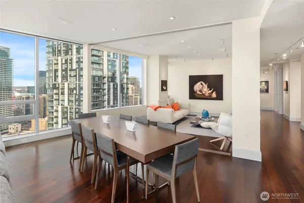 a view of a dining room with furniture and wooden floor