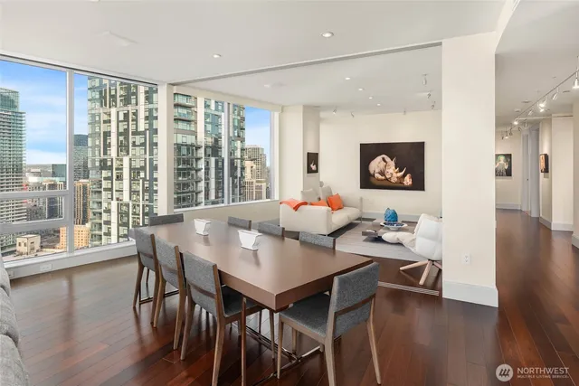 a view of a dining room with furniture and wooden floor