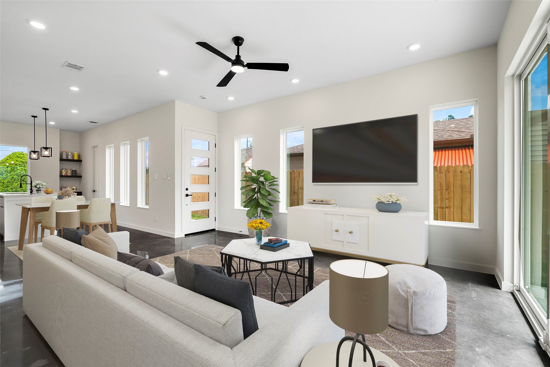 a living room with furniture and a flat screen tv