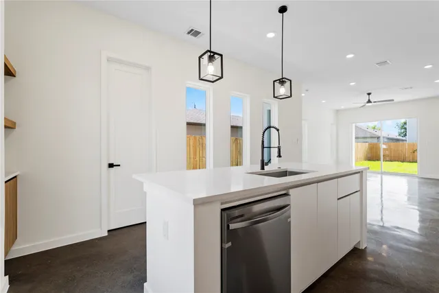 a kitchen with a sink and a window