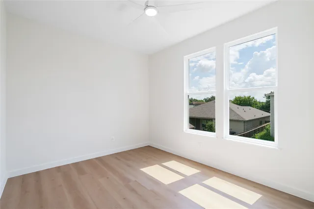 a view of an empty room with a window