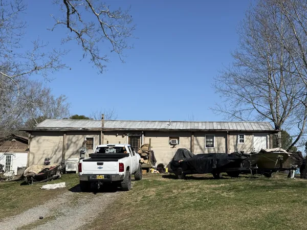 a view of a couches and a table in the patio