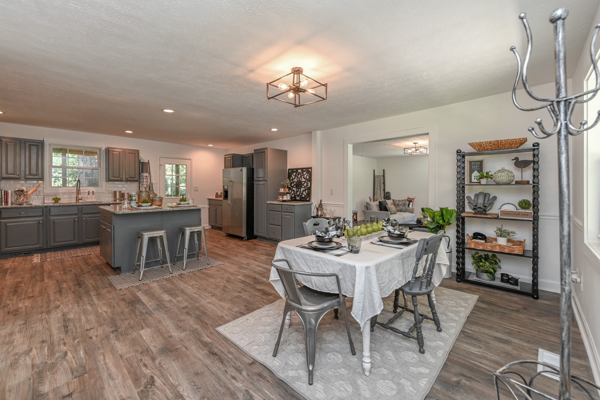 665 Hog Back Ridge Road Bethpage, TN 37022 - Photo 1 of 66 a dining area with a table chairs and a kitchen view