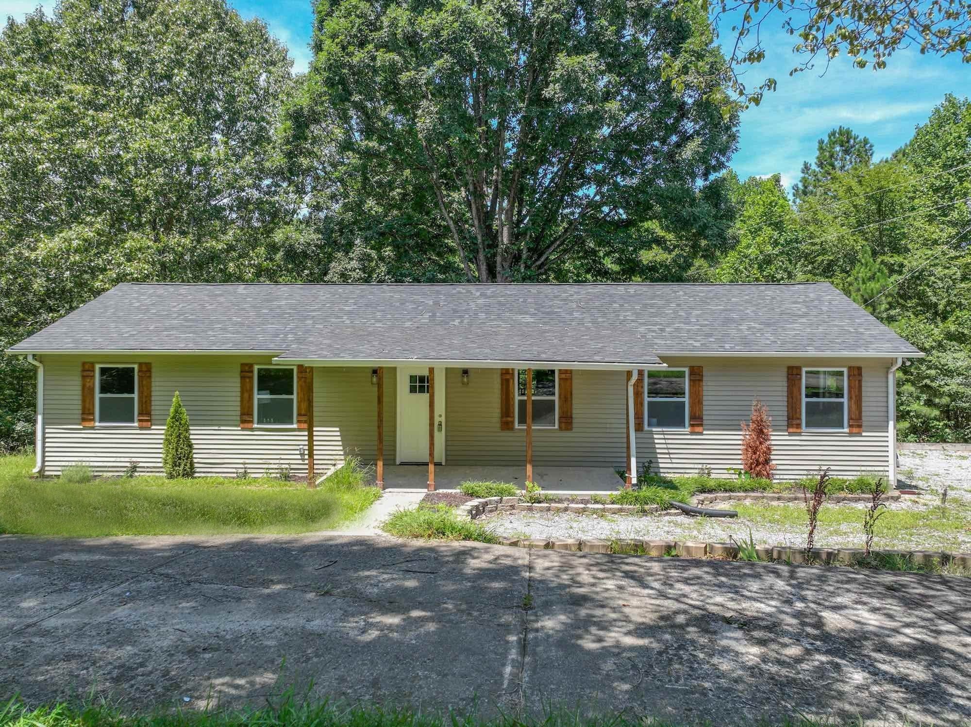 665 Hog Back Ridge Road Bethpage, TN 37022 - Photo 26 of 66 a front view of a house with garden