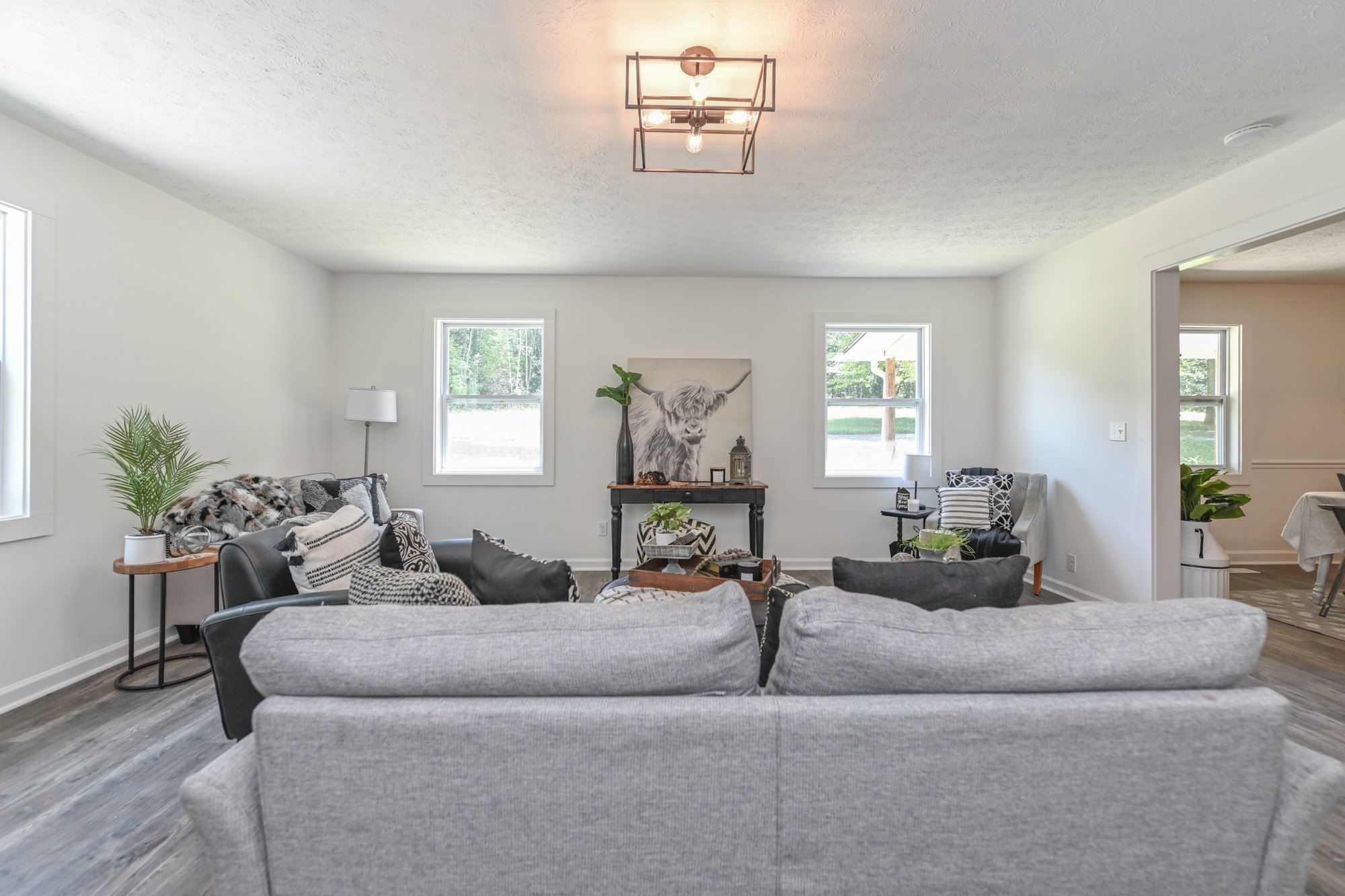 665 Hog Back Ridge Road Bethpage, TN 37022 - Photo 32 of 66 a living room with furniture and a potted plant