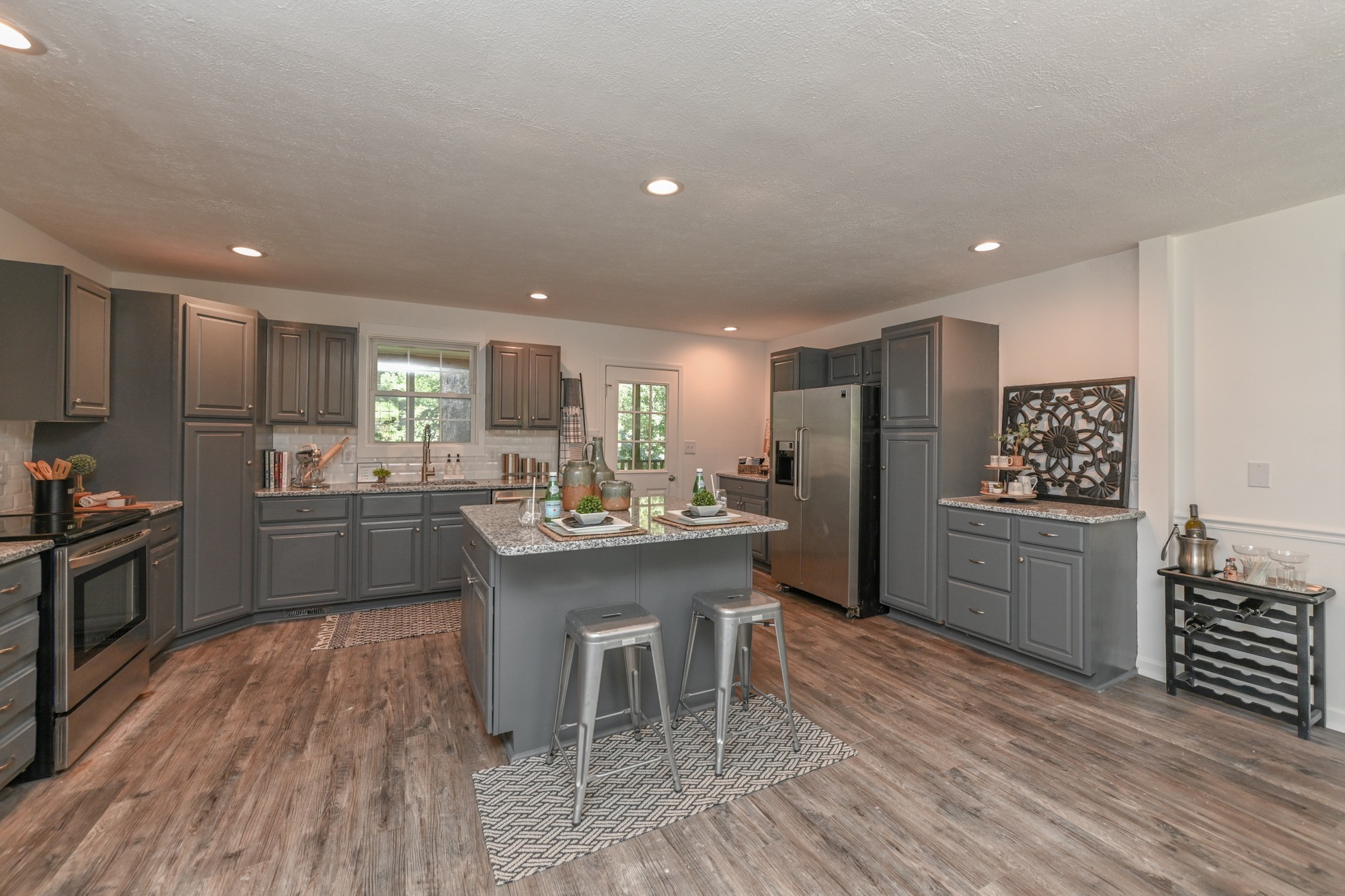 665 Hog Back Ridge Road Bethpage, TN 37022 - Photo 37 of 66 a kitchen with a sink cabinets and stainless steel appliances