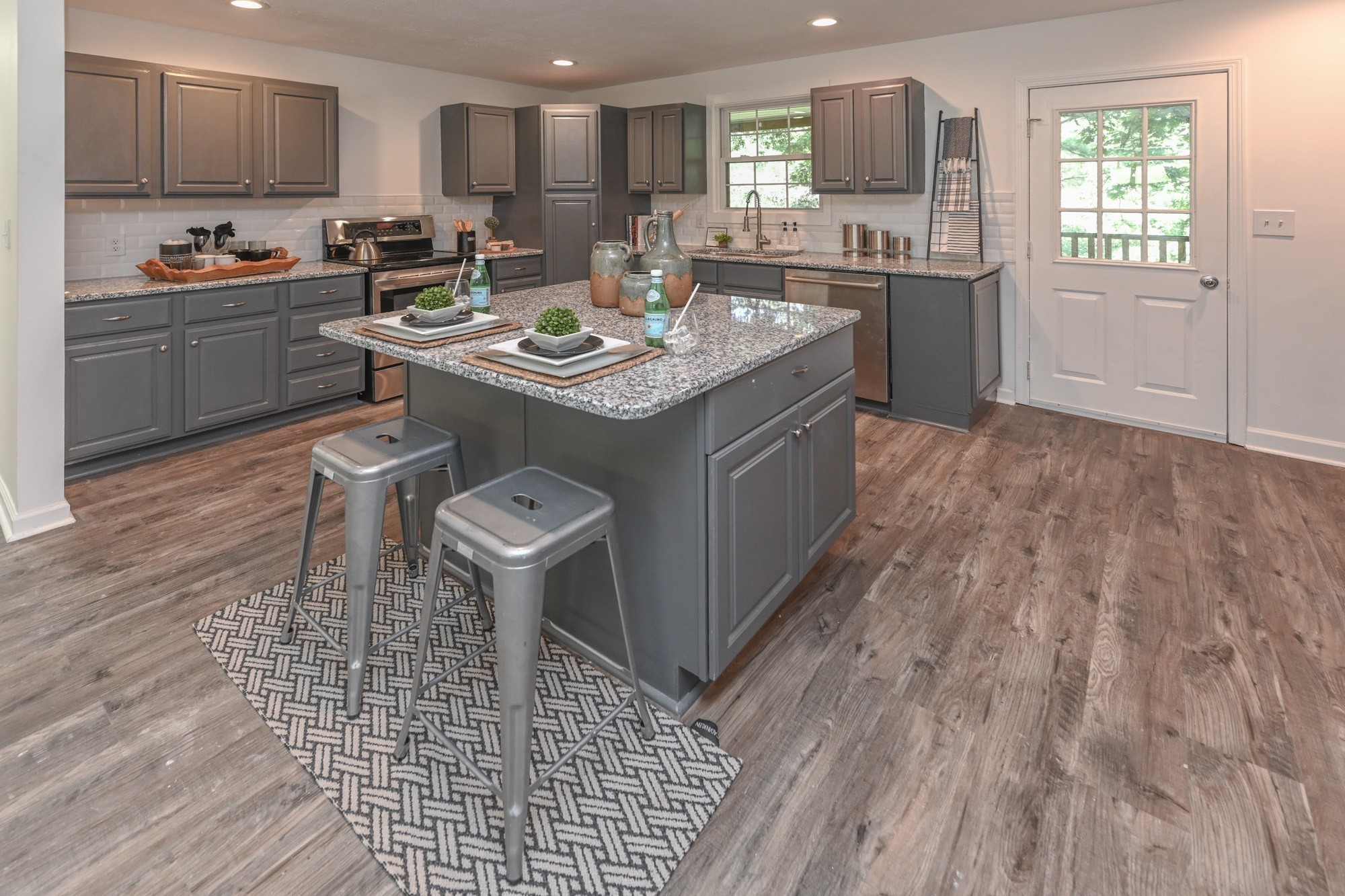 665 Hog Back Ridge Road Bethpage, TN 37022 - Photo 38 of 66 a kitchen with a sink appliances and cabinets