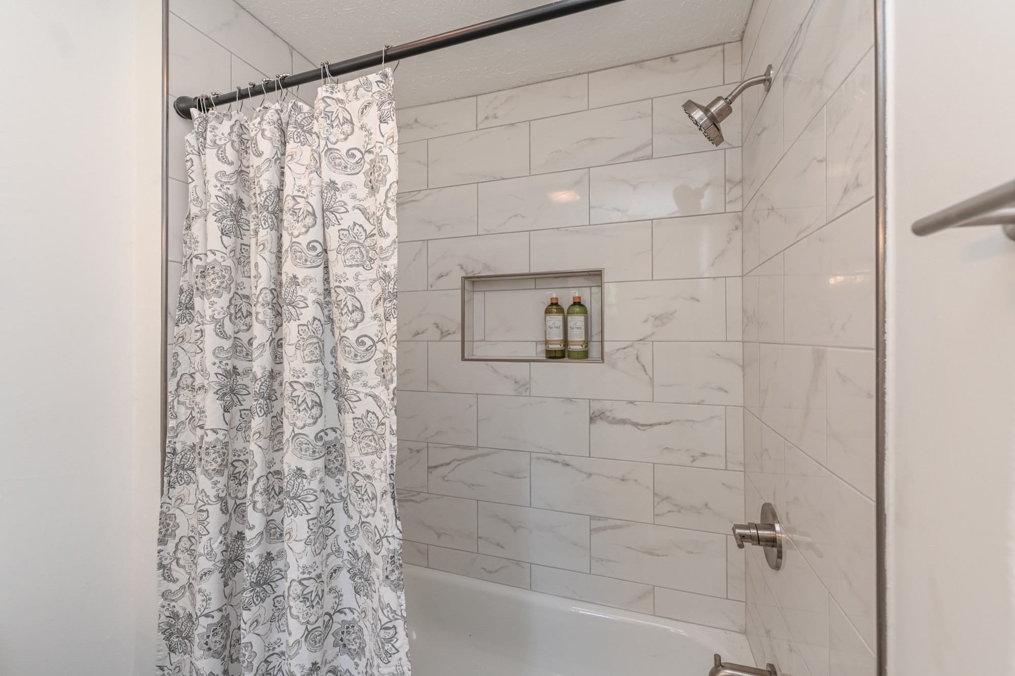 665 Hog Back Ridge Road Bethpage, TN 37022 - Photo 46 of 66 a bathroom with a shower curtain