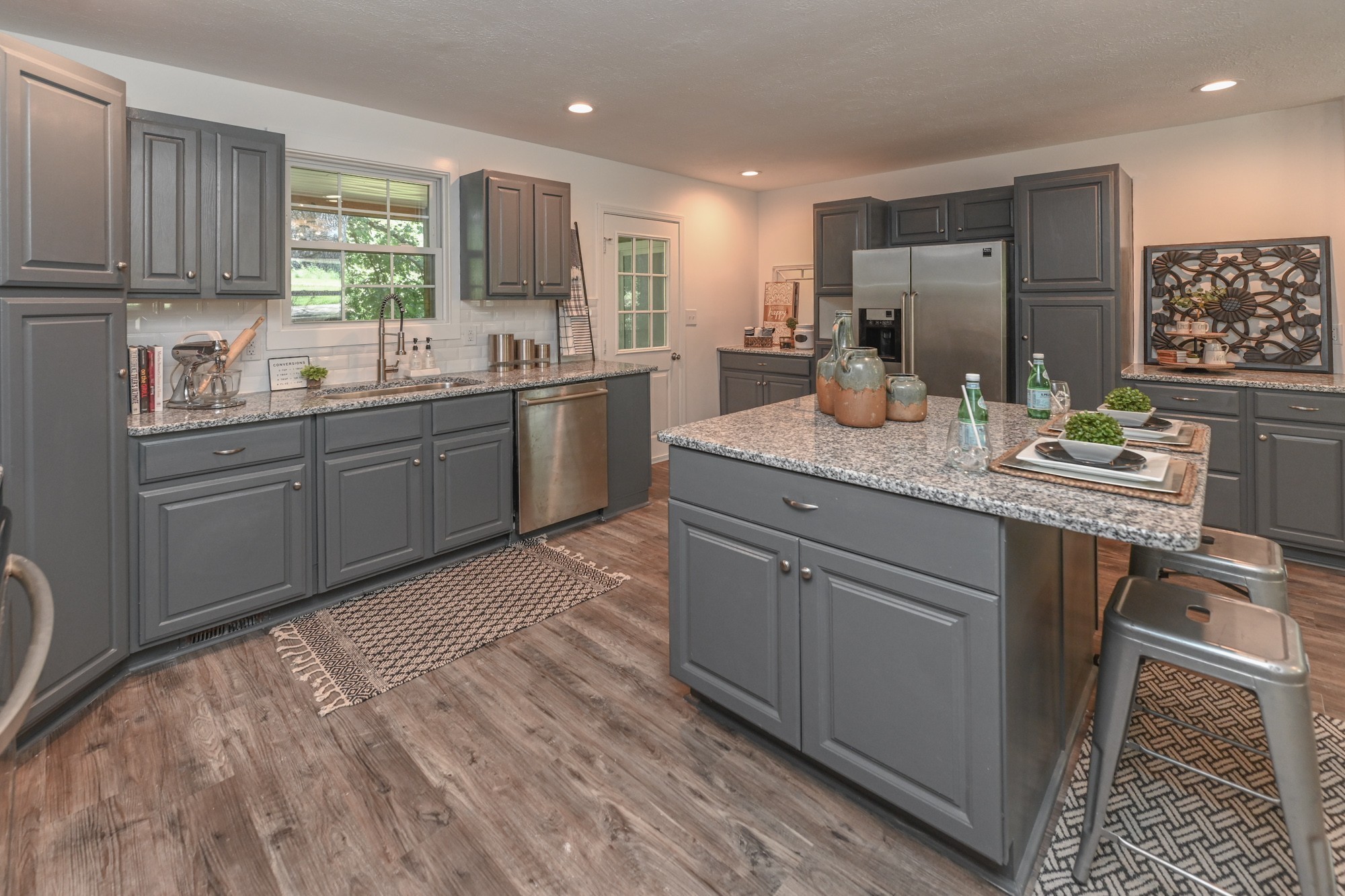 665 Hog Back Ridge Road Bethpage, TN 37022 - Photo 48 of 66 a kitchen with stainless steel appliances granite countertop a sink stove and cabinets