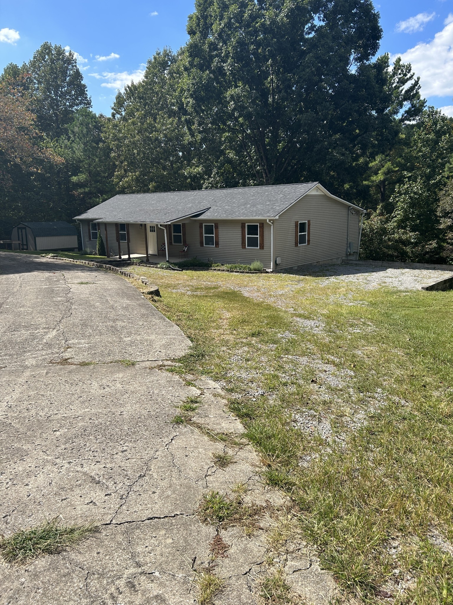 665 Hog Back Ridge Road Bethpage, TN 37022 - Photo 62 of 66 a front view of house with yard and trees in the background