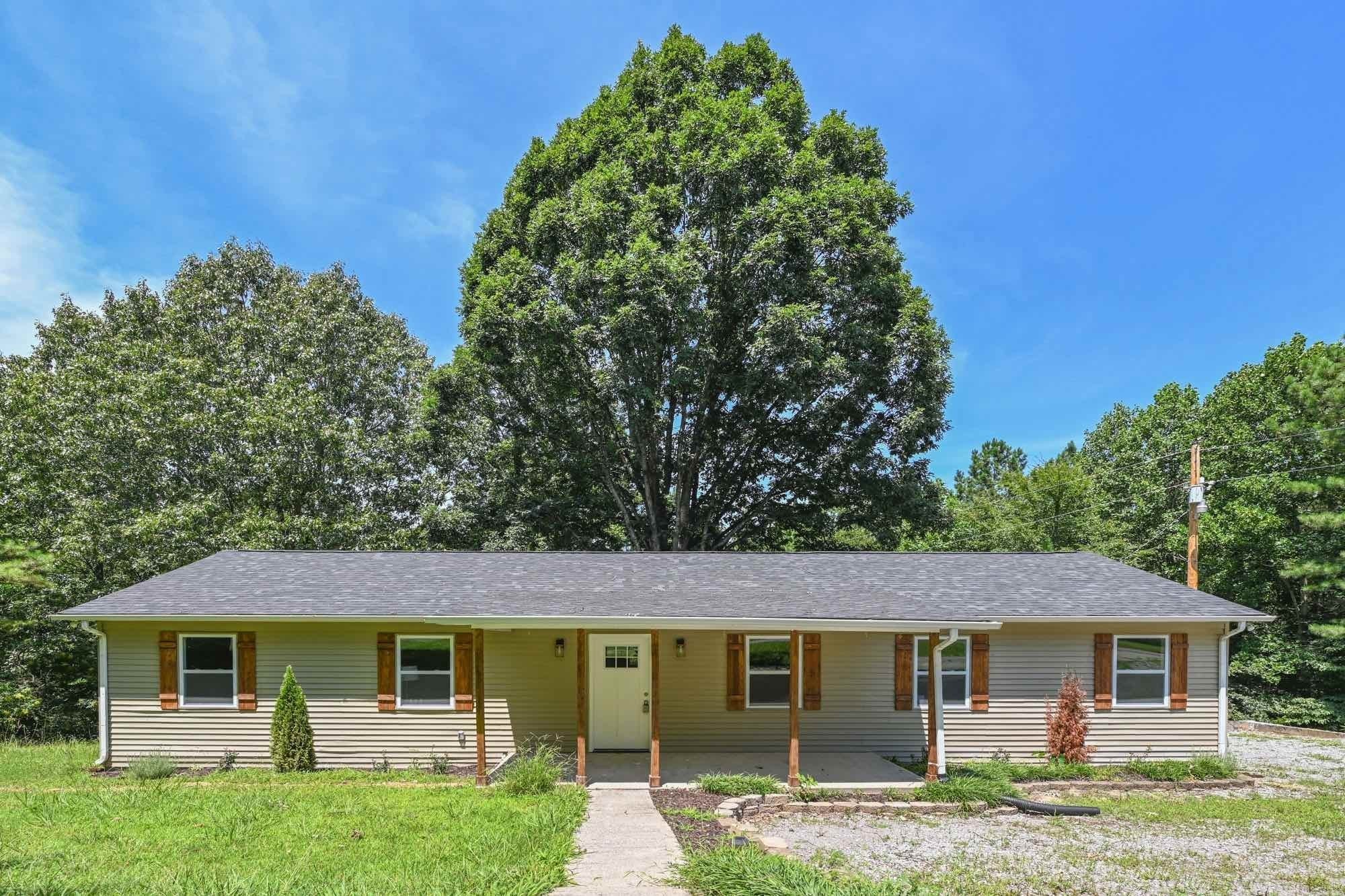 665 Hog Back Ridge Road Bethpage, TN 37022 - Photo 7 of 66 front view of a house and a yard