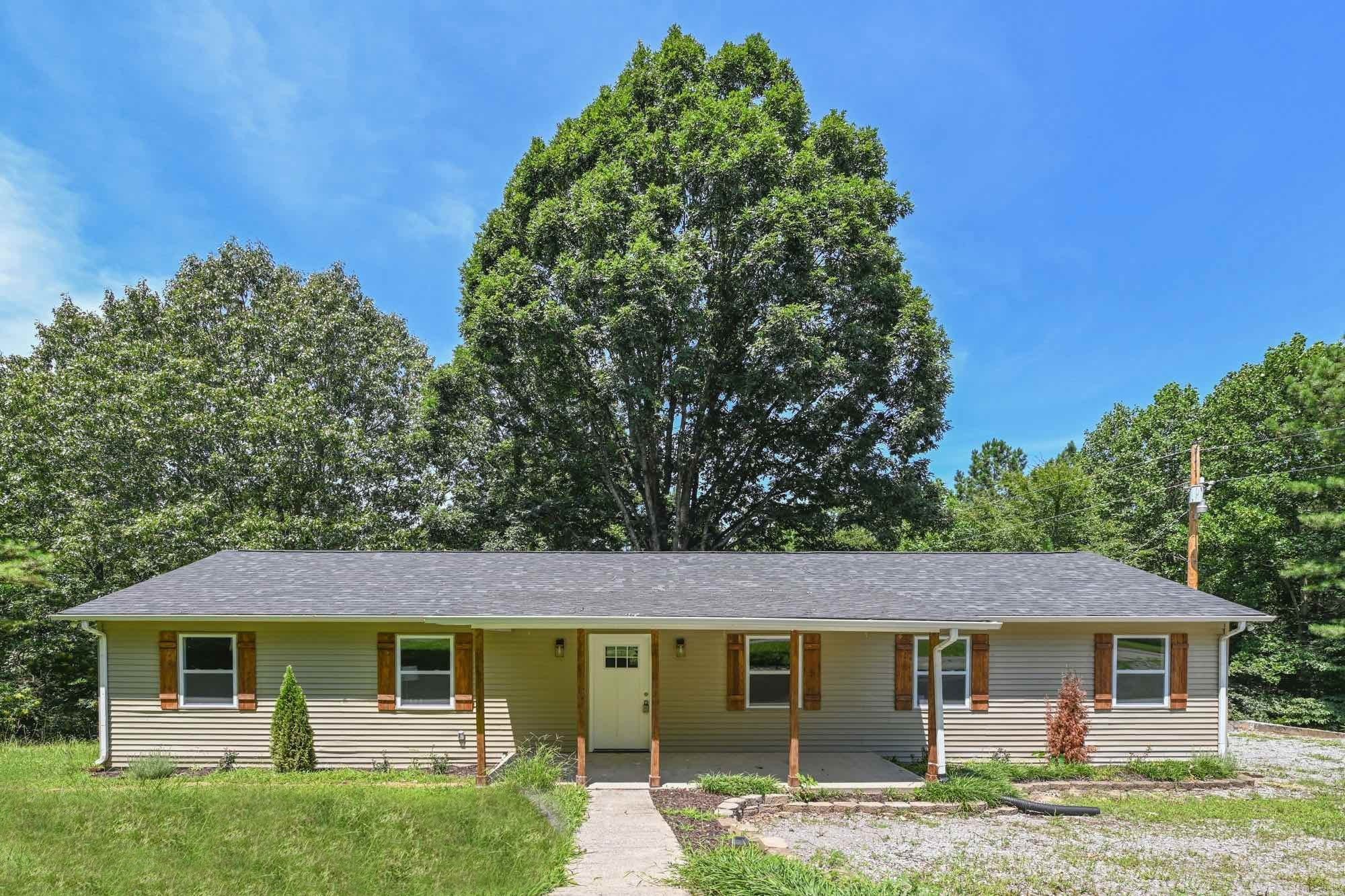 665 Hog Back Ridge Road Bethpage, TN 37022 - Photo 8 of 66 front view of a house and a yard