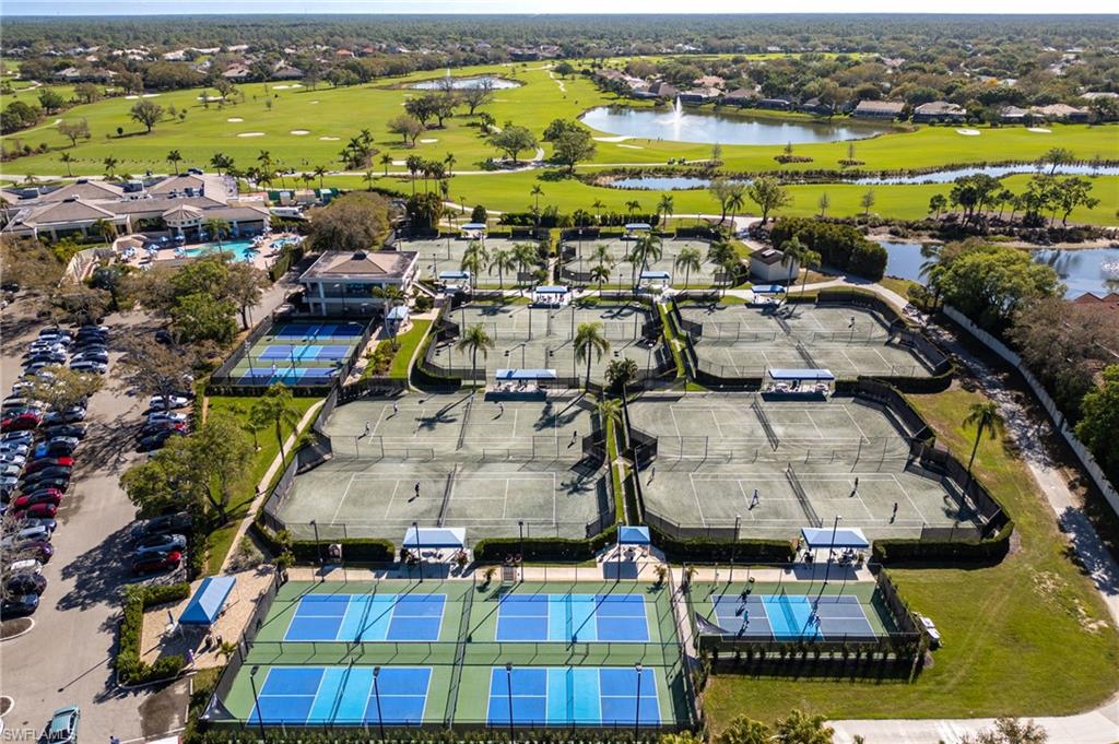 982 Fountain Run Naples, FL 34119 - Photo 39 of 44 Aerial view of residential area with a local golf course and a nearby body of water