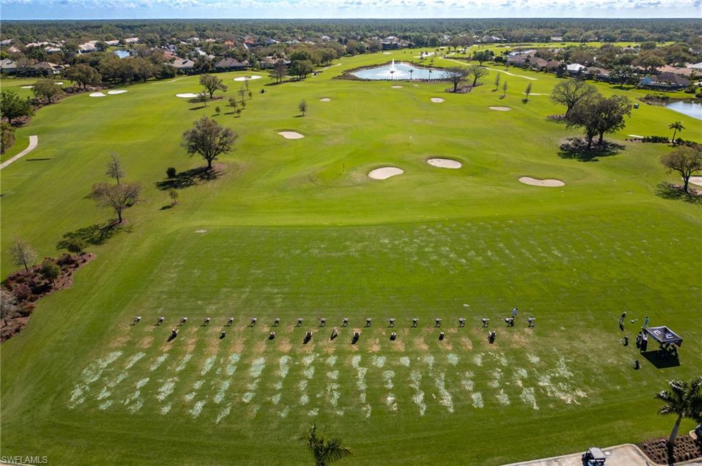 982 Fountain Run Naples, FL 34119 - Photo 40 of 44 Aerial perspective of suburban area with a nearby body of water and a local golf course