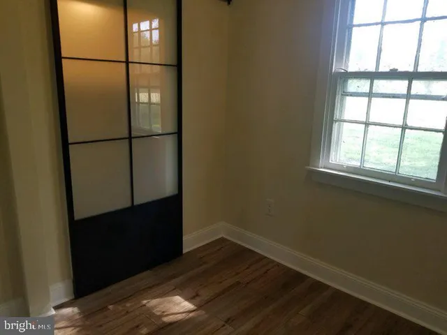 a view of front door with wooden floor