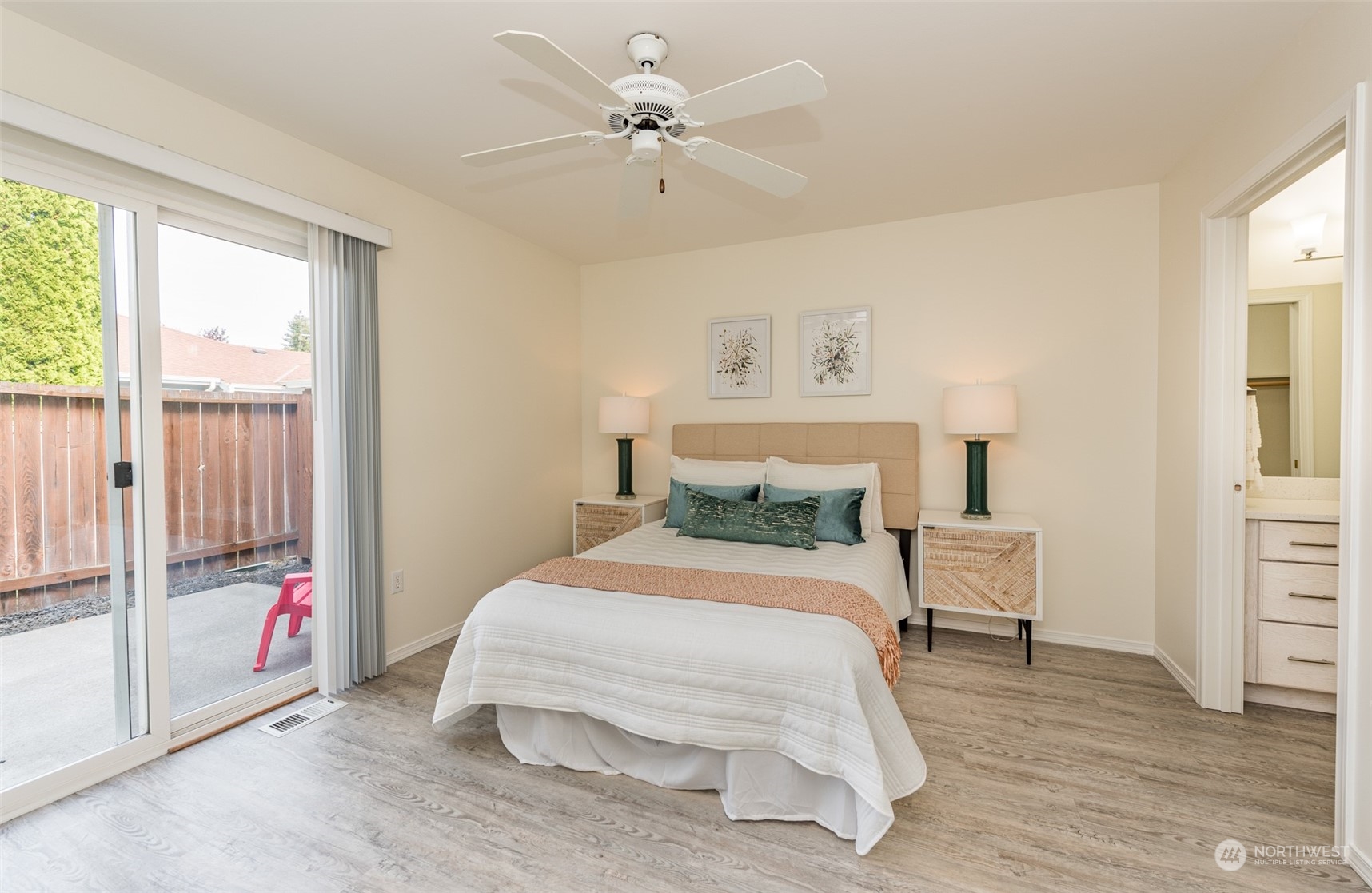 818 East Washington Place Sequim, WA 98382 - Photo 12 of 28 a bedroom with a bed and a window