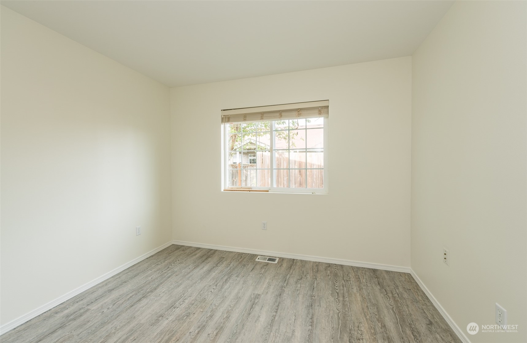 818 East Washington Place Sequim, WA 98382 - Photo 19 of 28 an empty room with a window