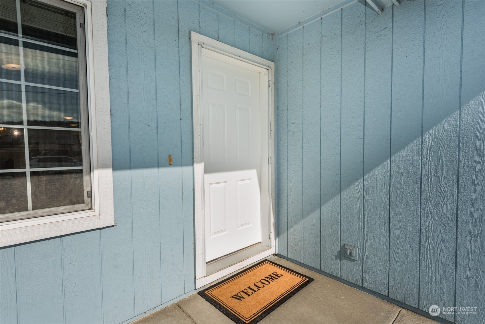 818 East Washington Place Sequim, WA 98382 - Photo 4 of 28 a view of an empty room with a window