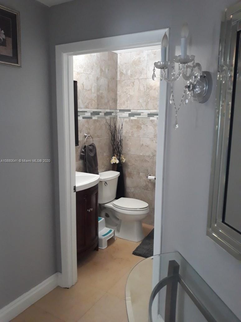 6466 Brava Way Boca Raton, FL 33433 - Photo 36 of 50 a bathroom with a toilet and a sink