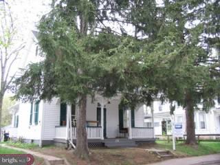 124 Fern Road Riegelsville, PA 18077 - Photo 1 of 1 a tree in front of a white house