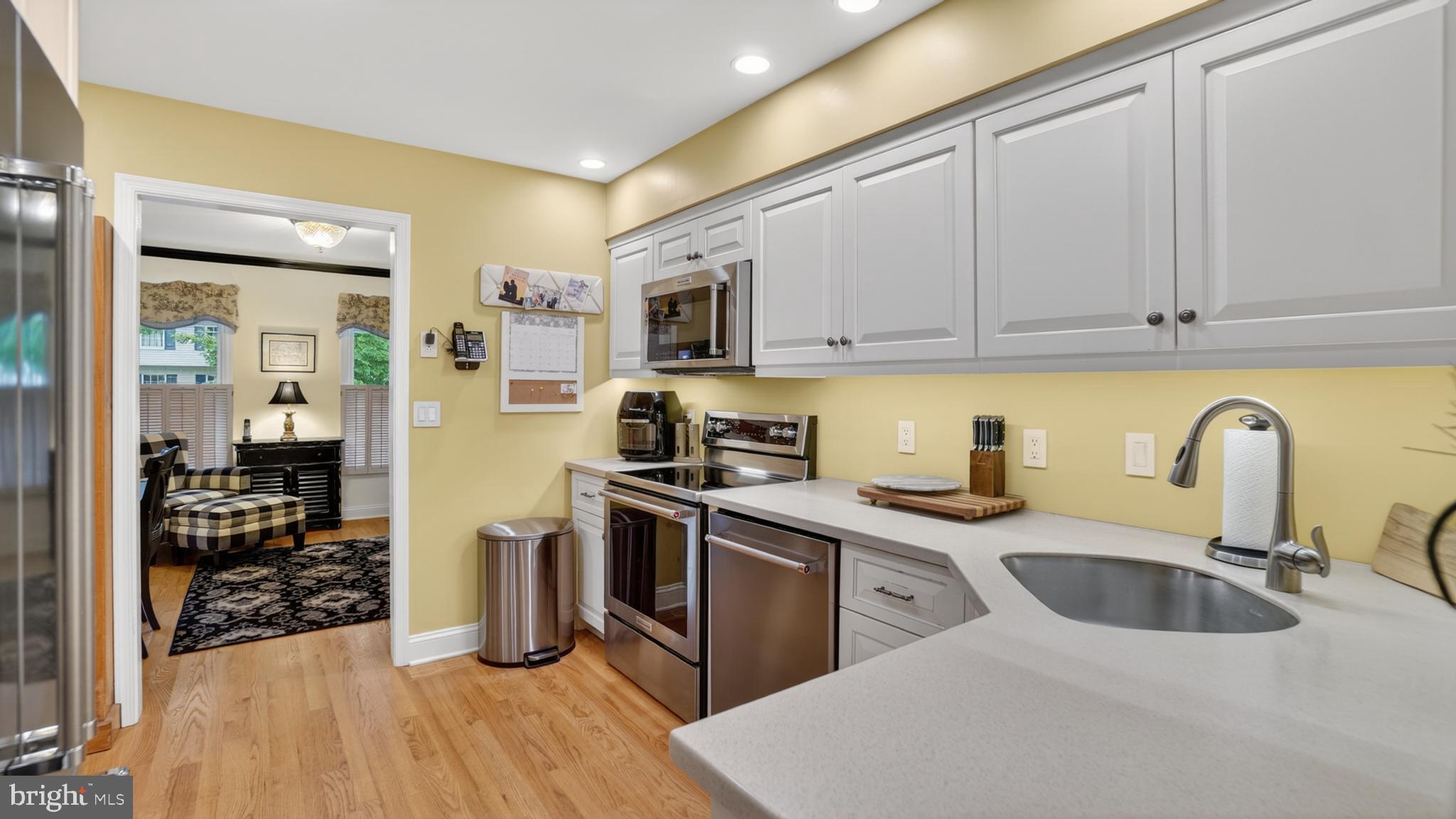 317 Canterfield Road Annapolis, MD 21403 - Photo 16 of 66 a kitchen with stainless steel appliances granite countertop a sink stove refrigerator and cabinets