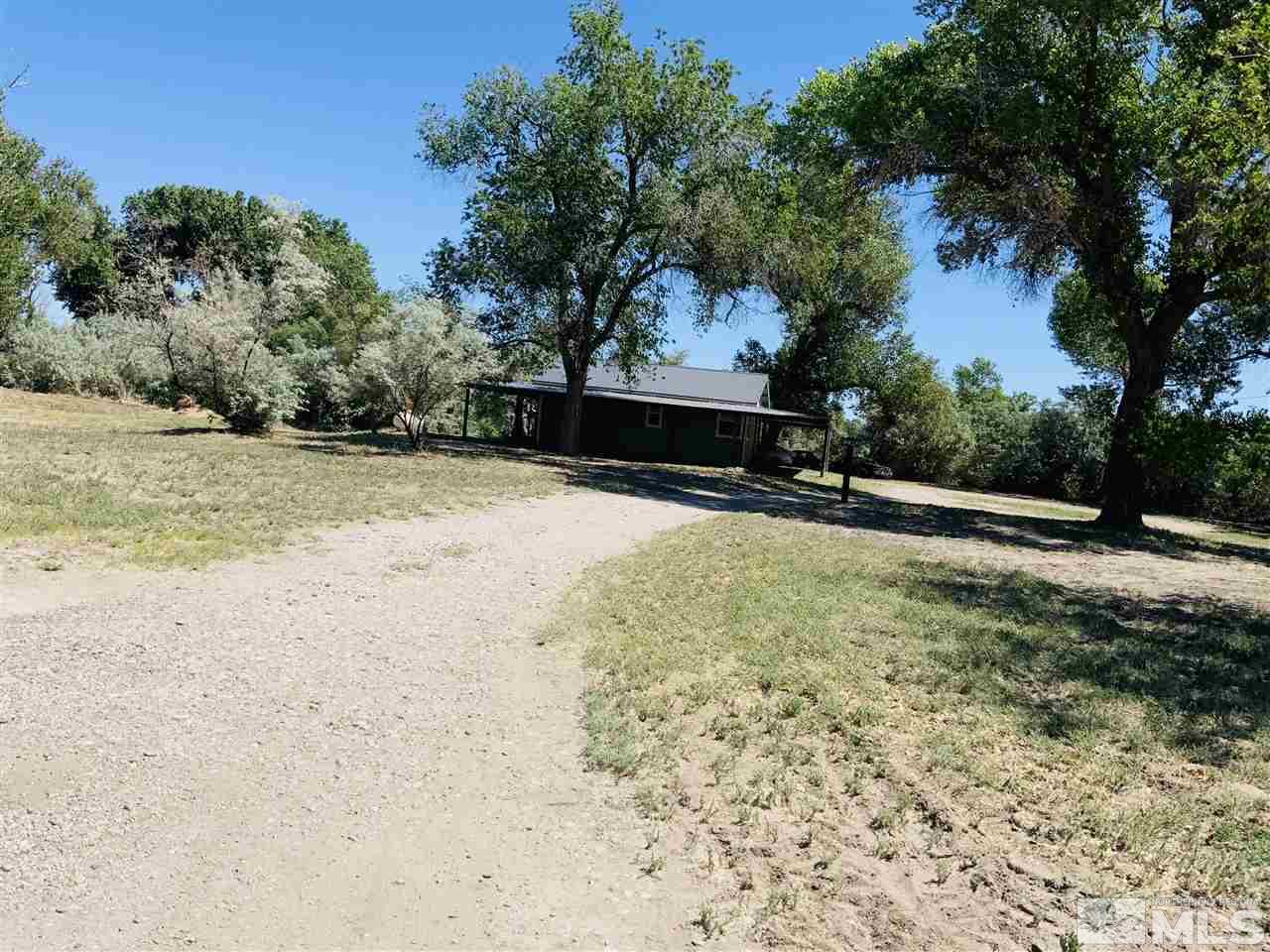 3830 Alcorn Road, Unit RD Fallon, NV 89406 - Photo 1 of 20 a view of road with large trees