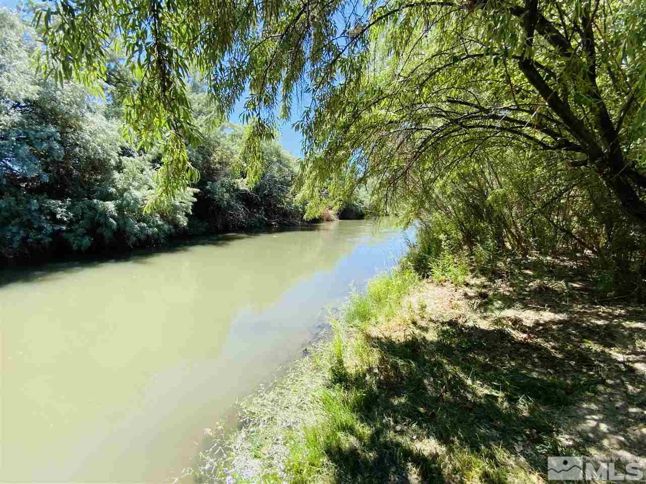 3830 Alcorn Road, Unit RD Fallon, NV 89406 - Photo 13 of 20 a view of a lake with a yard