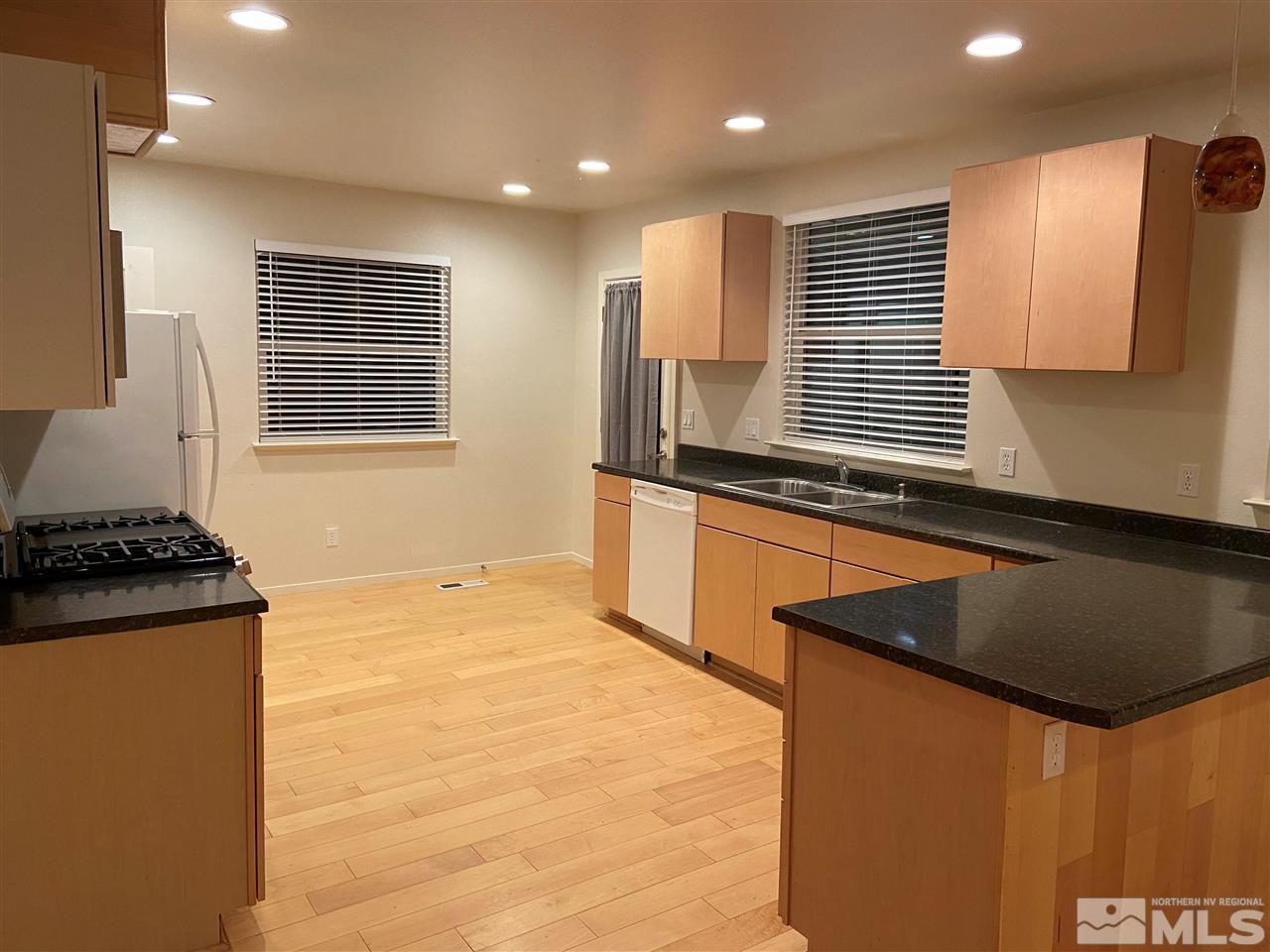3830 Alcorn Road, Unit RD Fallon, NV 89406 - Photo 16 of 20 a kitchen with stainless steel appliances granite countertop a sink and a stove