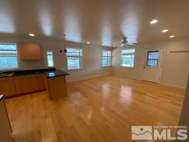 3830 Alcorn Road, Unit RD Fallon, NV 89406 - Photo 19 of 20 a view of an empty room with window and wooden floor