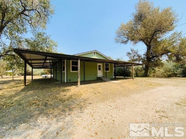 3830 Alcorn Road, Unit RD Fallon, NV 89406 - Photo 3 of 20 a front view of a house with a yard and garage