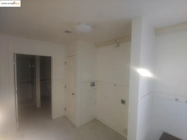 a white toilet sitting next to a bath tub