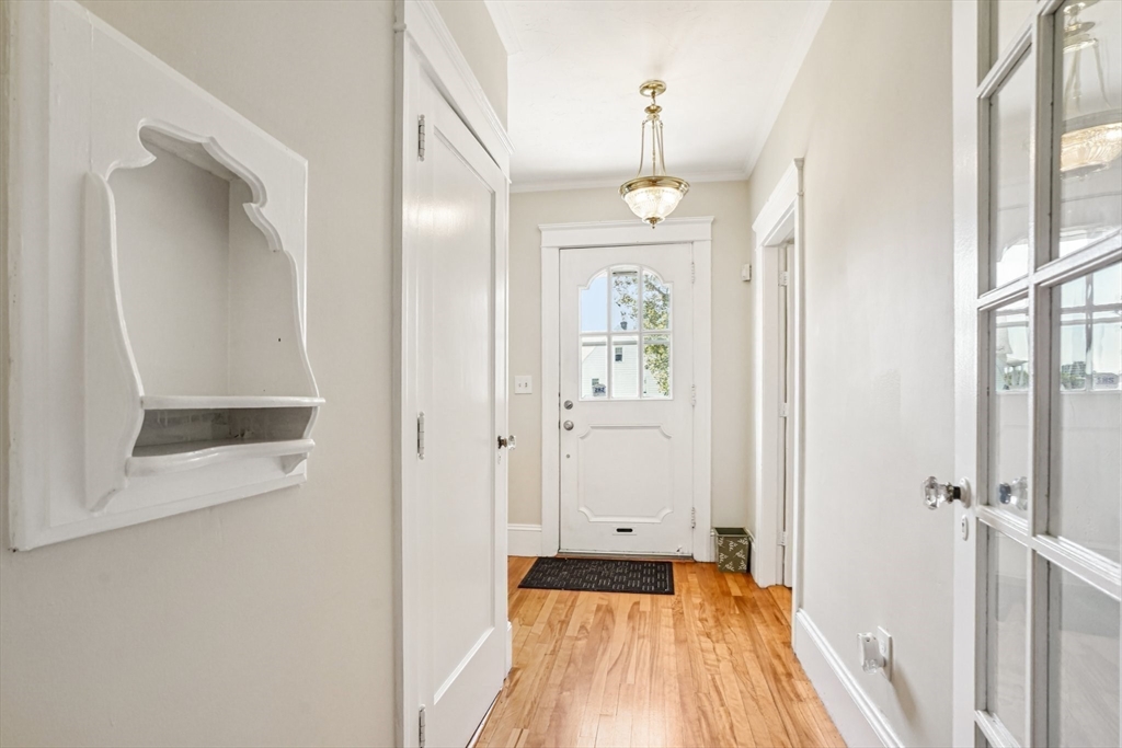 174 Park Avenue, Unit 1 Worcester, MA 01602 - Photo 11 of 34 a view of a hallway with wooden floor and a bathroom