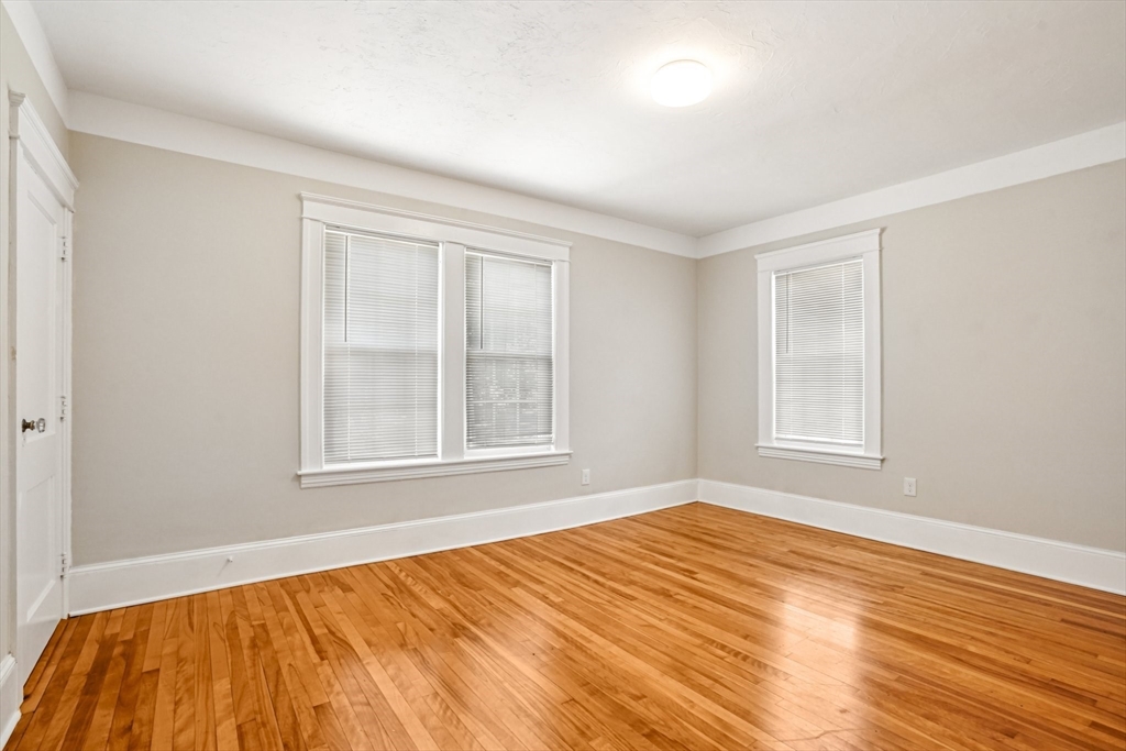 174 Park Avenue, Unit 1 Worcester, MA 01602 - Photo 16 of 34 a bedroom with a bed and a window