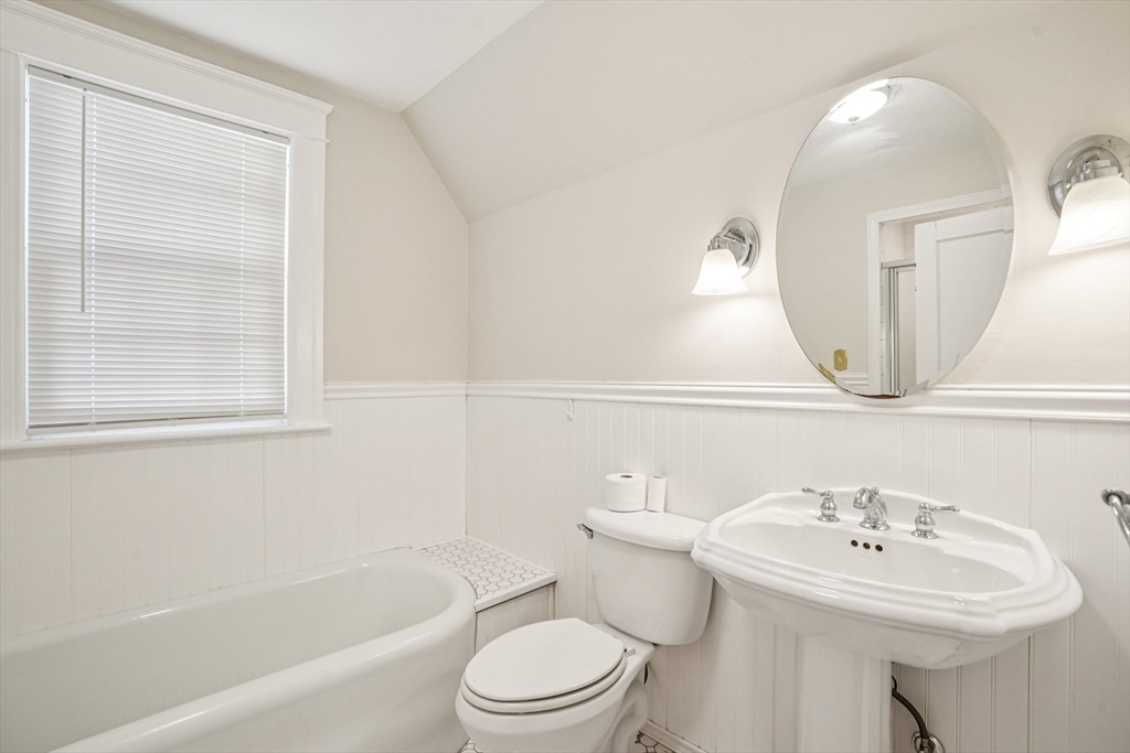 174 Park Avenue, Unit 1 Worcester, MA 01602 - Photo 20 of 34 a bathroom with a sink a toilet and a mirror