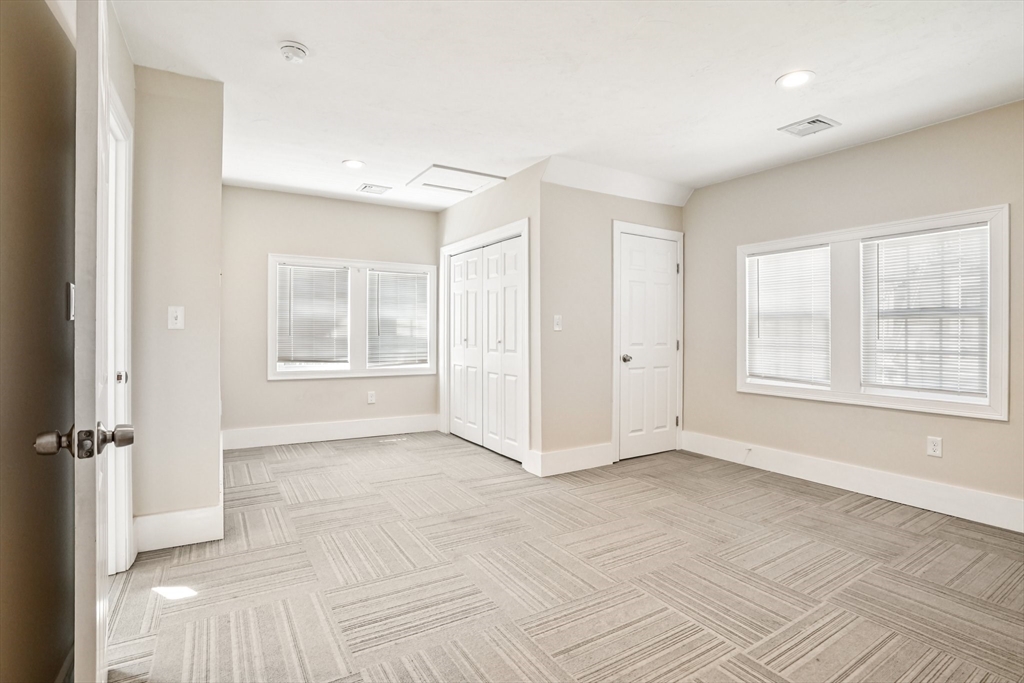 174 Park Avenue, Unit 1 Worcester, MA 01602 - Photo 31 of 34 a view of an empty room with a window