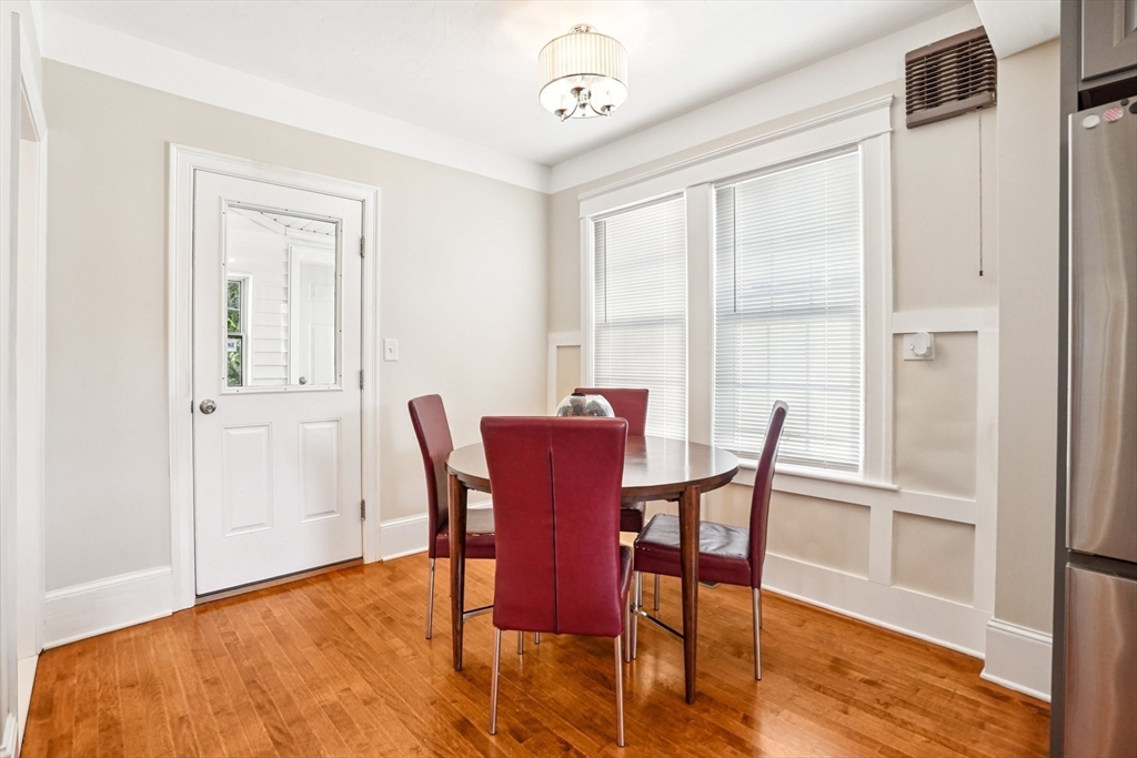 174 Park Avenue, Unit 1 Worcester, MA 01602 - Photo 10 of 34 a view of a dining room with furniture window and wooden floor