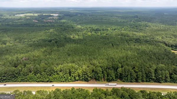 a view of a yard with an outdoor seating