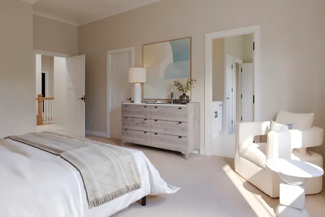 a bedroom with a bed and a dresser