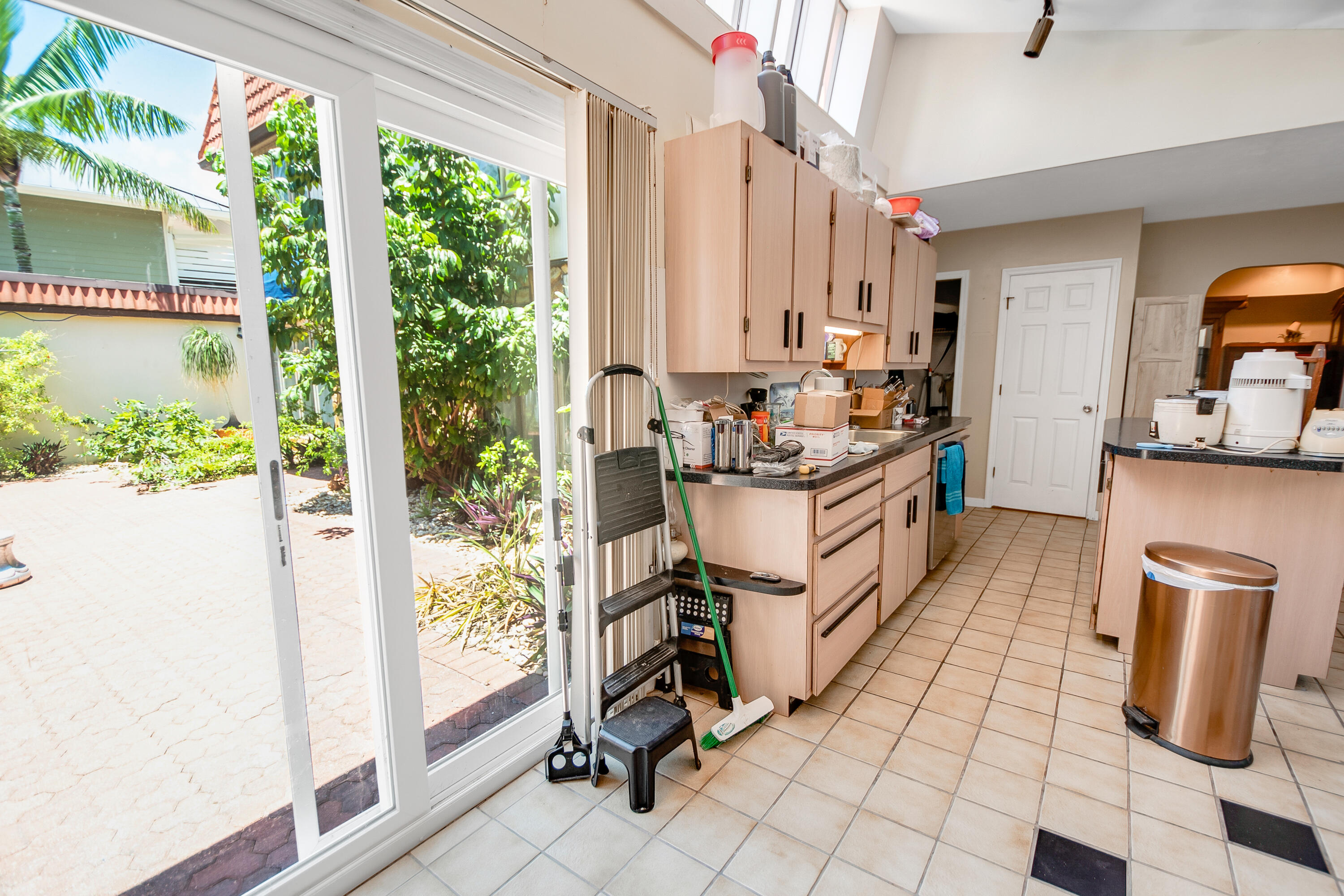 11 Capri Boulevard Naples, FL 34113 - Photo 11 of 39 a kitchen with a sink and a stove top oven