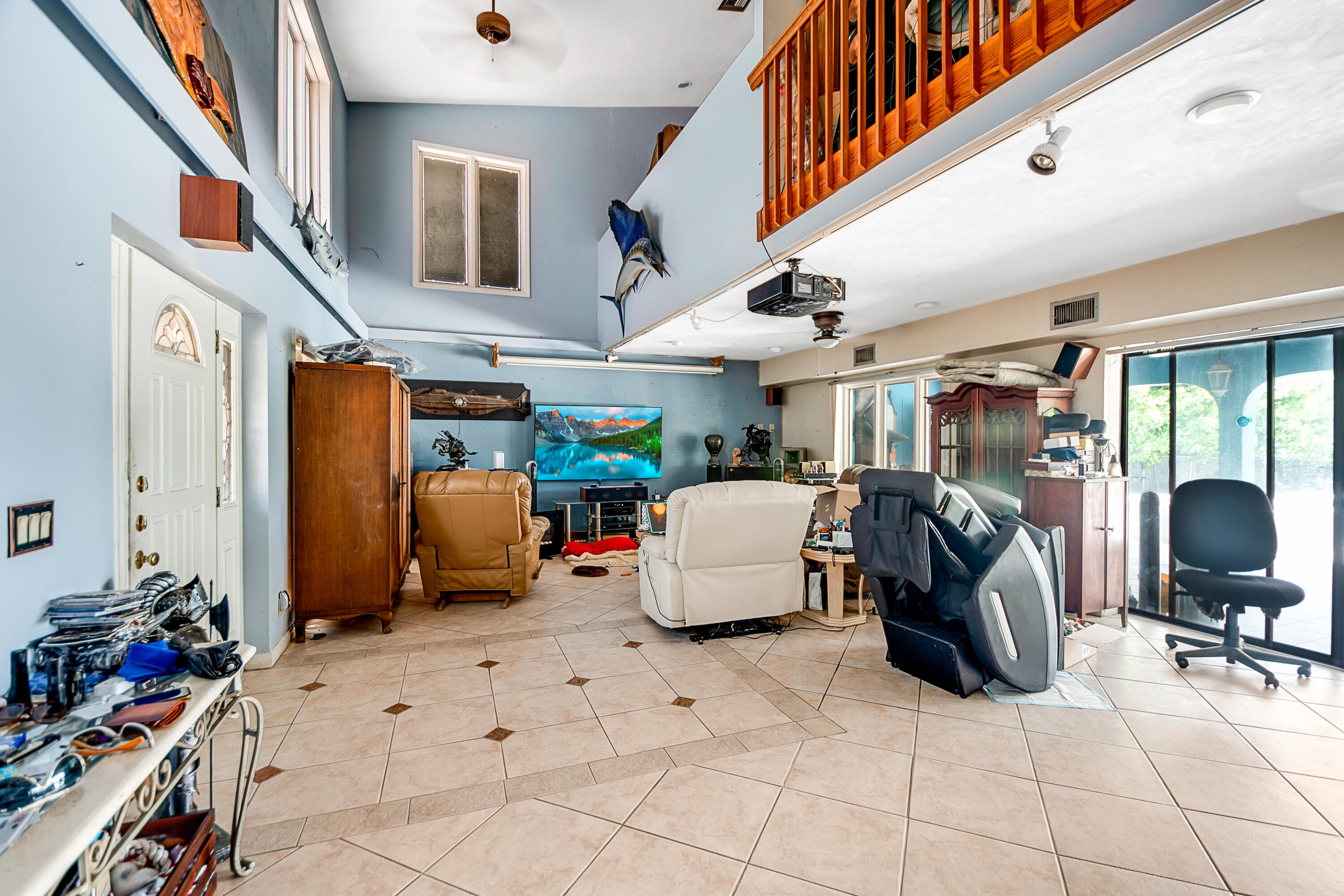 11 Capri Boulevard Naples, FL 34113 - Photo 21 of 39 a room with gym equipment and a large window